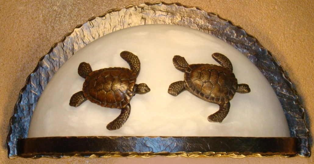 Two turtles are sitting in a tray of water.