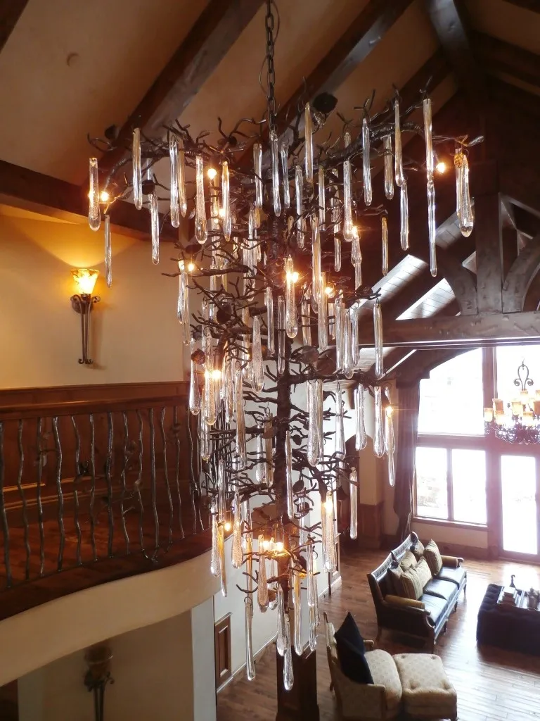 A chandelier with many lights hanging from the ceiling.