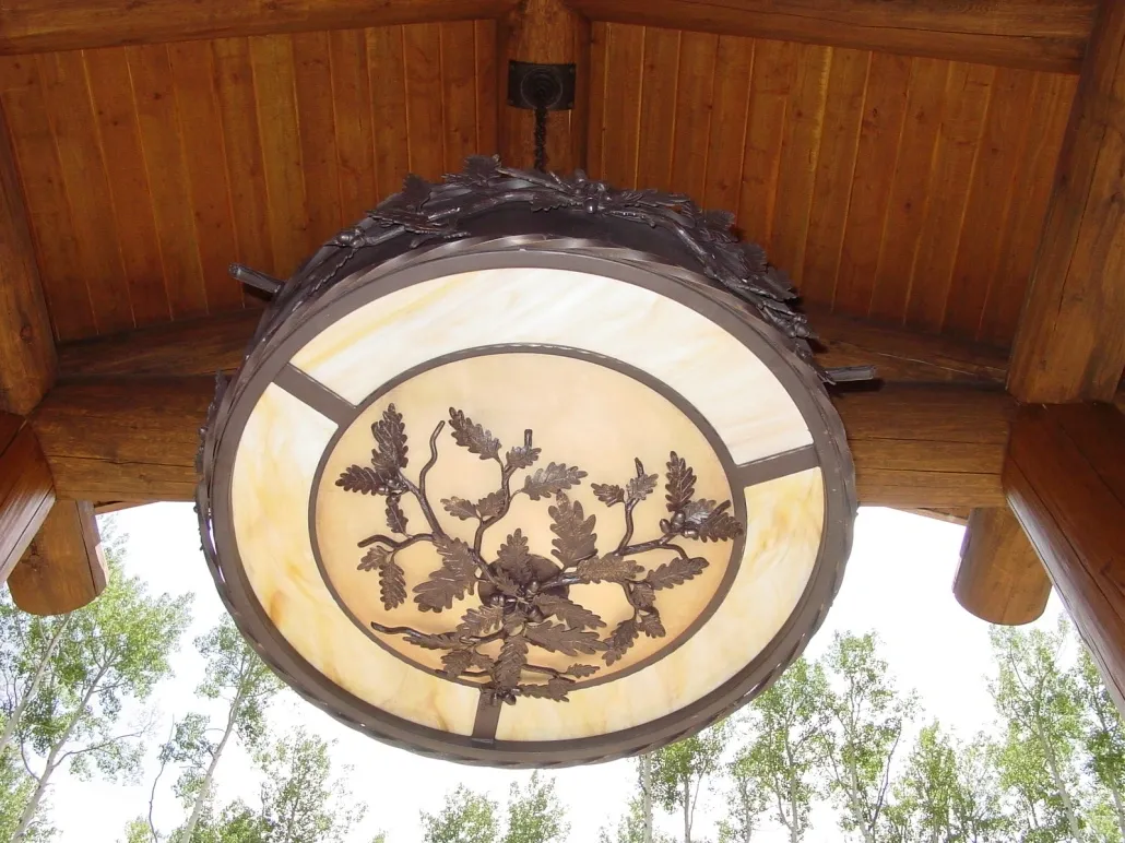 A light fixture hanging from the ceiling of a house.