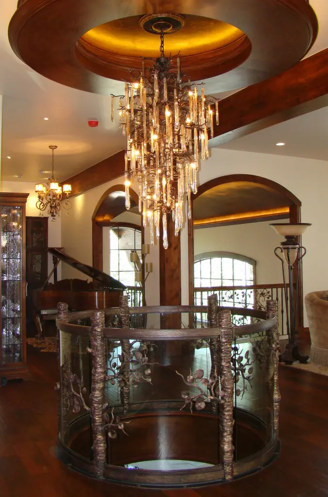 A chandelier hanging from the ceiling in a room.