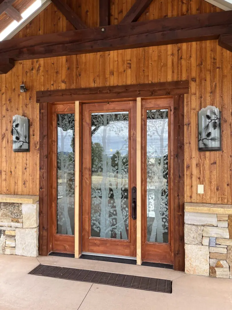 A front door of a house with wood paneling.