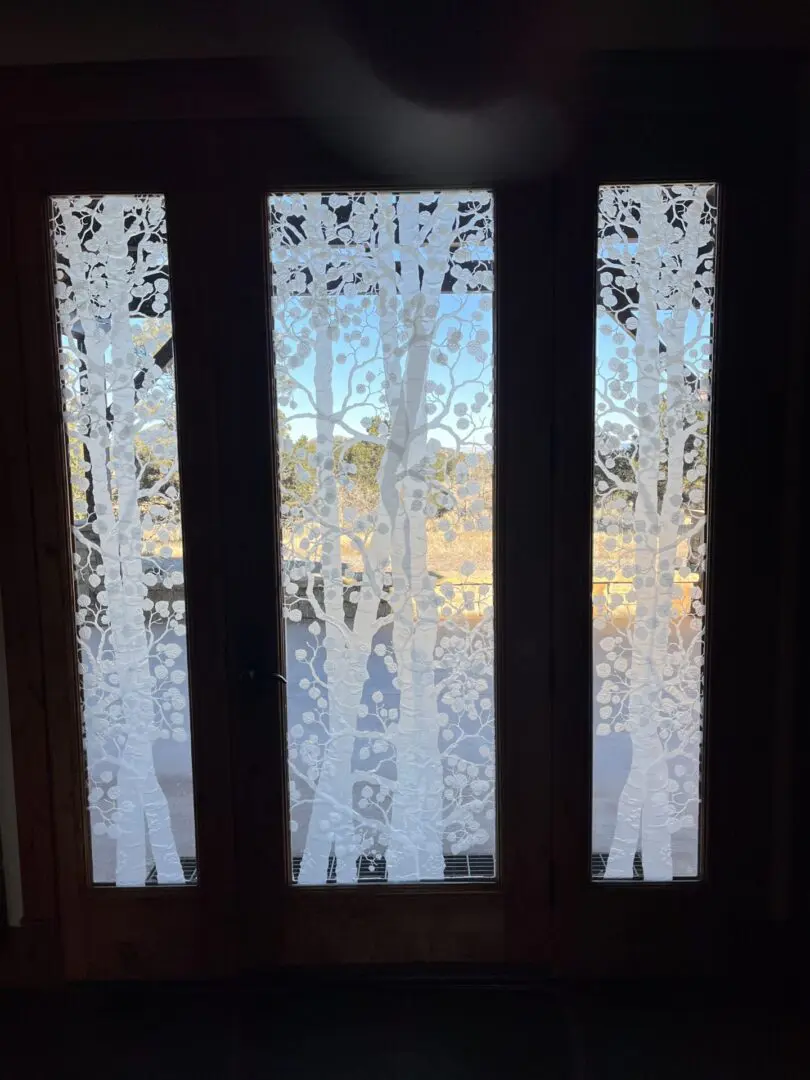 A window with curtains that are open and closed.